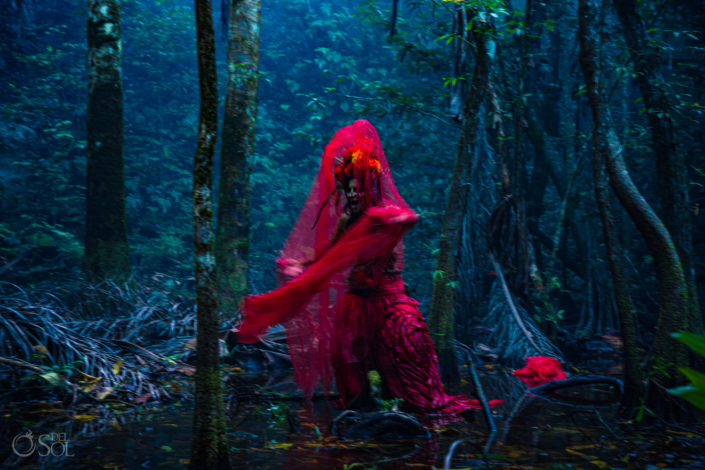 Woman dressed as a red Cartina for the day of the dead in the jungle