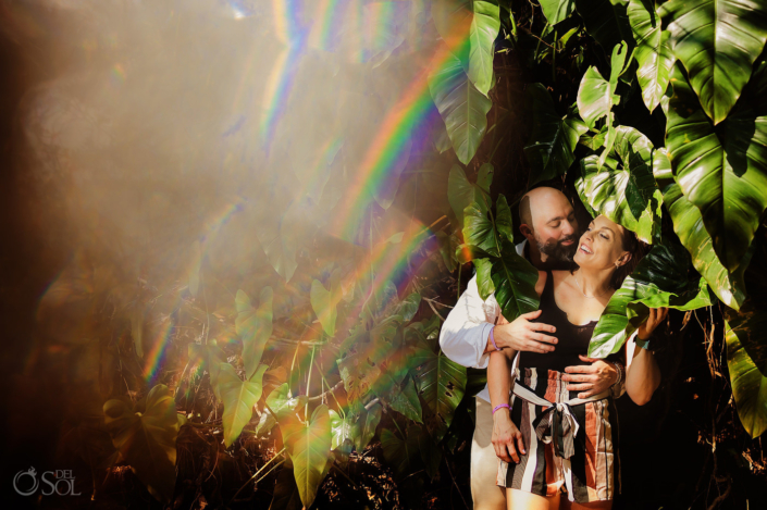 Candid couples portrait photography with tropical green leaves