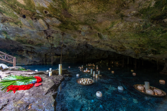 candle installation on the water for a cenote proposal in a private location Tulum Mexico