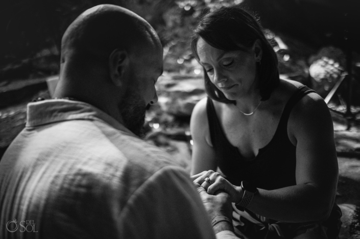 timeless black and white photograph of putting the ring on your partners finger