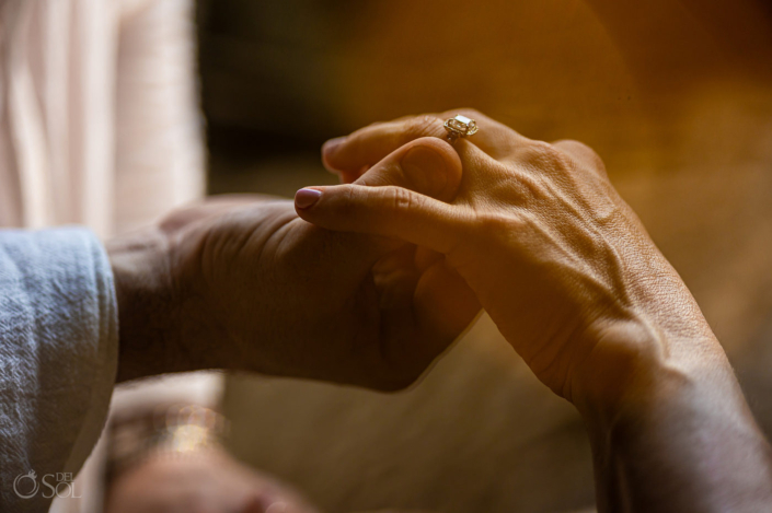 placing the ring on the finger of your loved one during a cenote proposal in a private location Tulum Mexico