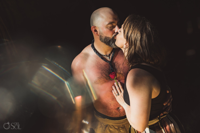 bride and groom-to-be kiss in a cave after their proposal