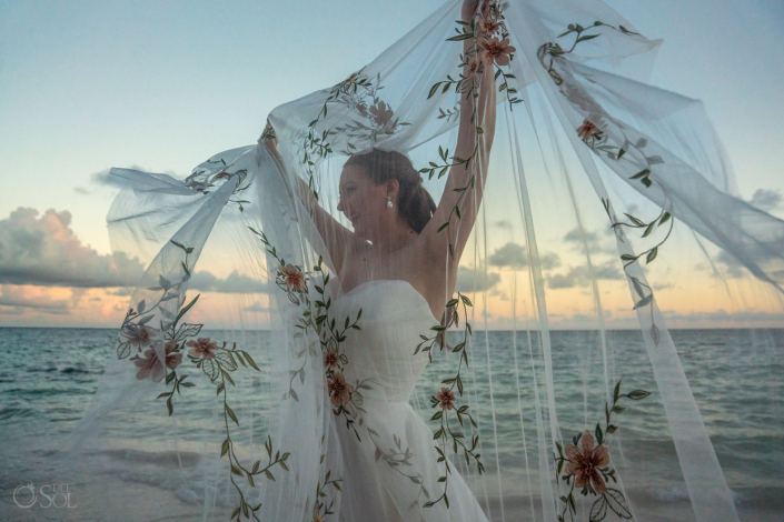 bride with veil destination beach wedding at Secrets Akumal Adults only arch ceremony