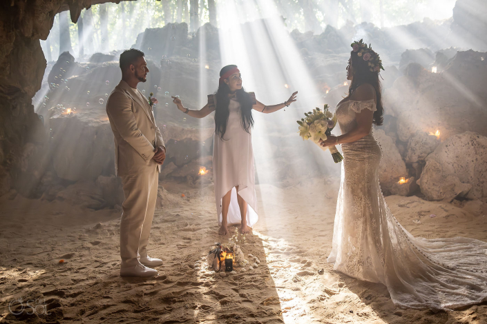 Couple sharing a quiet moment during a micro wedding cenote ceremony in paradise