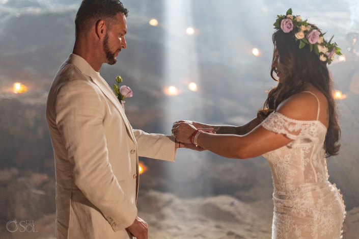 Bride and groom sharing a private moment during an intimate cenote wedding ceremony