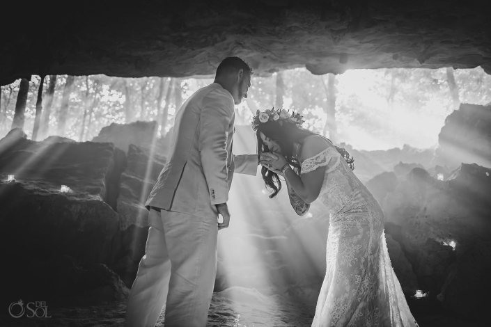 Intimate micro wedding cenote ceremony with a couple exchanging vows in the Riviera Maya