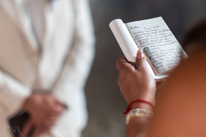 Intimate micro wedding cenote ceremony with a couple exchanging vows in the Riviera Maya