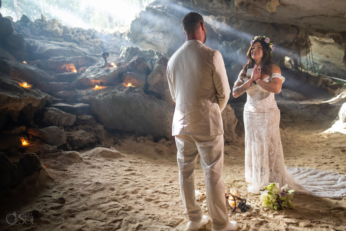 Intimate micro wedding cenote ceremony with a couple exchanging vows in the Riviera Maya