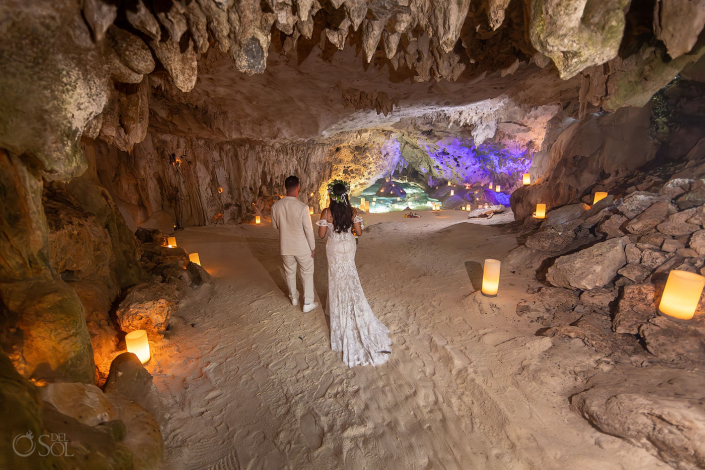 Intimate micro wedding cenote ceremony with a couple exchanging vows in the Riviera Maya