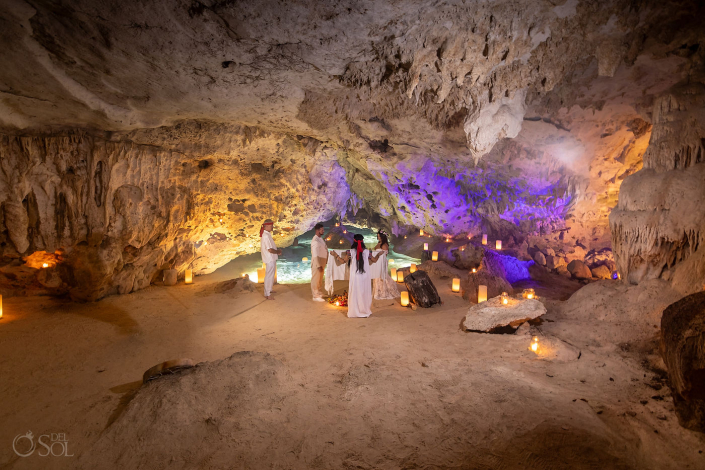 Intimate micro wedding cenote ceremony with a couple exchanging vows in the Riviera Maya