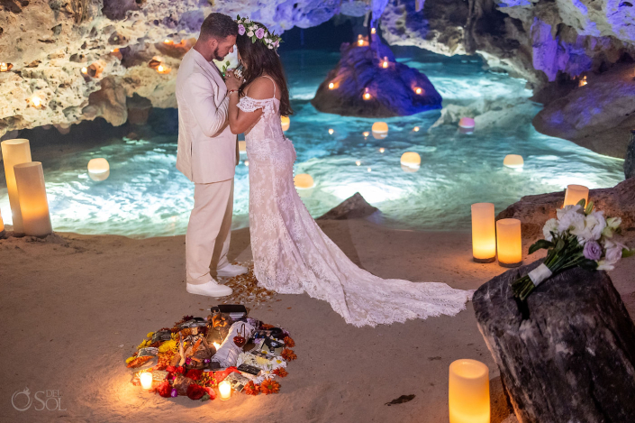 Intimate micro wedding cenote ceremony with a couple exchanging vows in the Riviera Maya