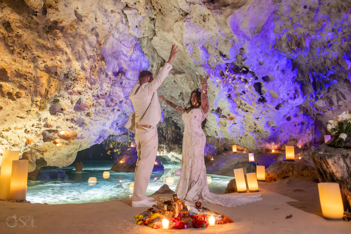 Intimate micro wedding cenote ceremony with a couple exchanging vows in the Riviera Maya