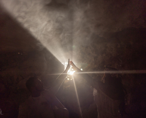 Bride and groom sharing a private moment during an intimate cenote wedding ceremony