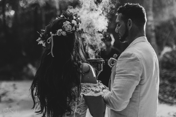 Bride and groom sharing a private moment during an intimate cenote wedding ceremony