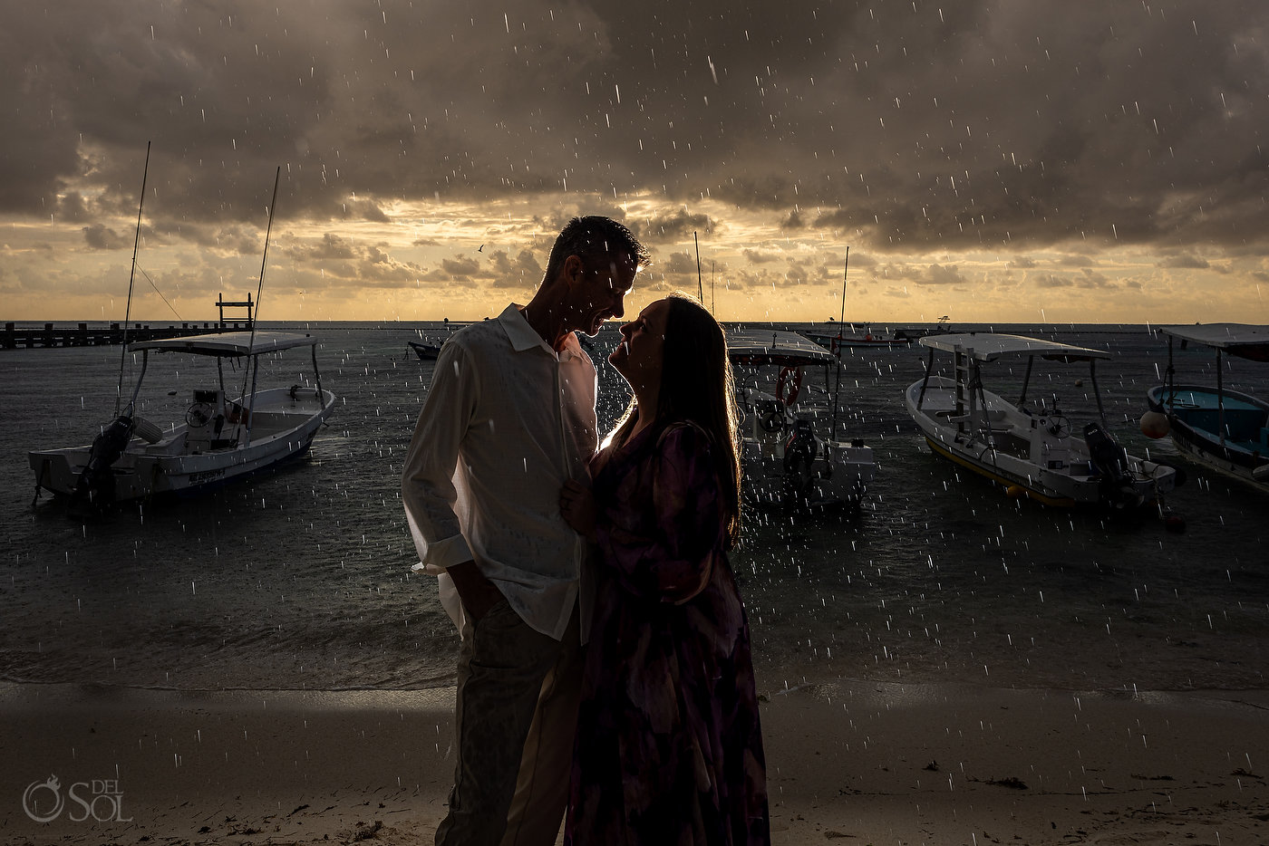 Intimate vow renewal moment focused on presence and connection in the rain
