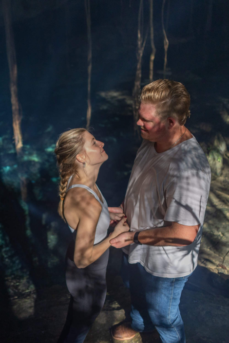 Cinematic cenote engagement session in Riviera Maya featuring soft light, reflections, and organic textures