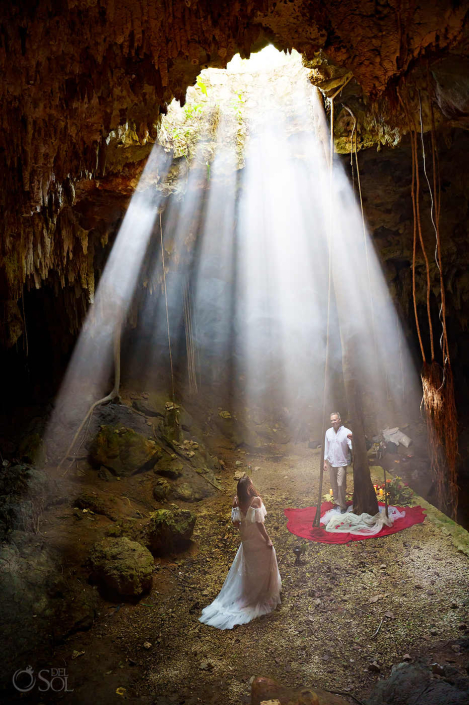 Natural light pouring into a cenote cave during a couple photography session