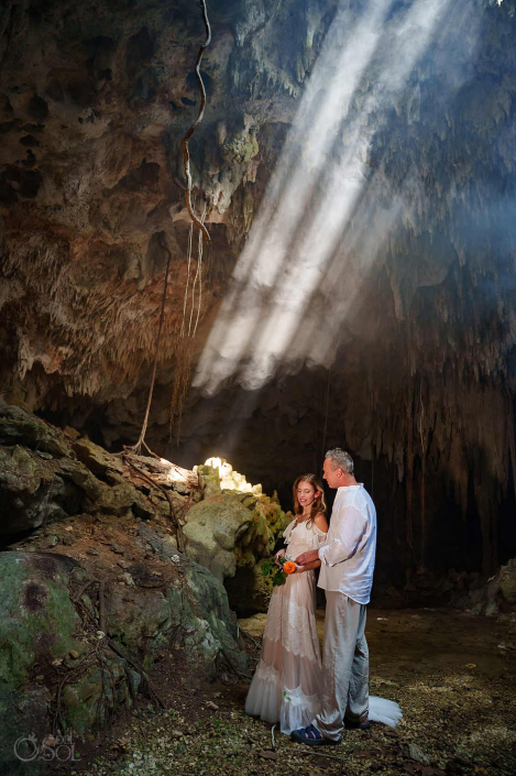 Artistic cenote couple portrait emphasizing emotion and connection