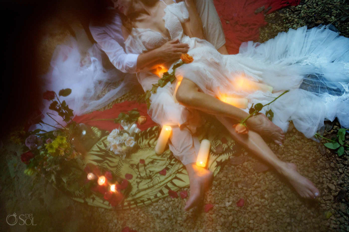 Intimate couple moment inside a cenote cave focused on presence and intention