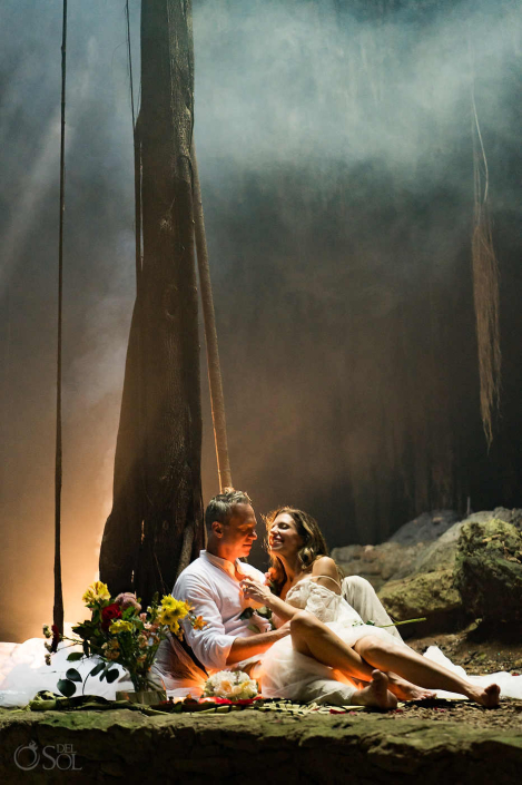 Couple photographed in epic cave light during a cenote session