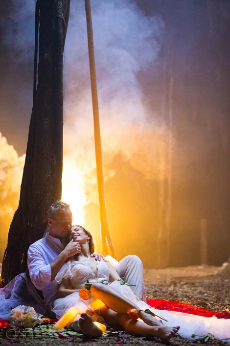 Cinematic cenote cave scene with a couple framed by light and shadow