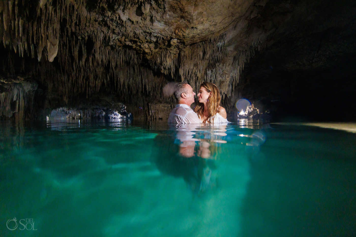 Underwater trash the dress session emphasizing fabric, form, and light