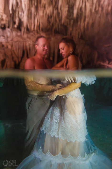Ritual inspired underwater cenote couple session photographed fully clothed