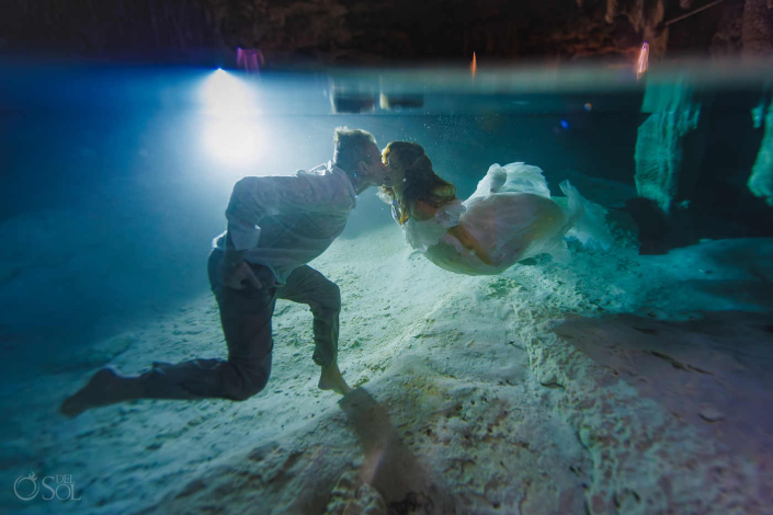 Artistic underwater cenote couple session following a trash the dress experience