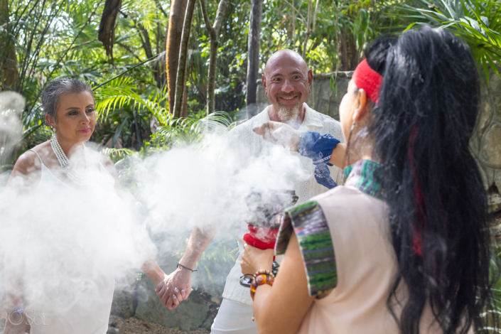 Copal smoke blessing during an intimate cenote vow renewal ceremony in Riviera Maya Mexico
