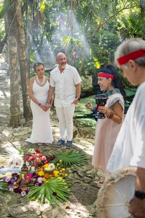Spiritual ceremony altar beside a crystal blue cenote in Mexico