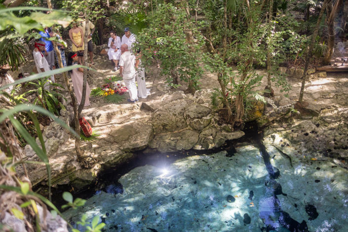 Natural cenote ceremony space in Riviera Maya Mexico surrounded by jungle