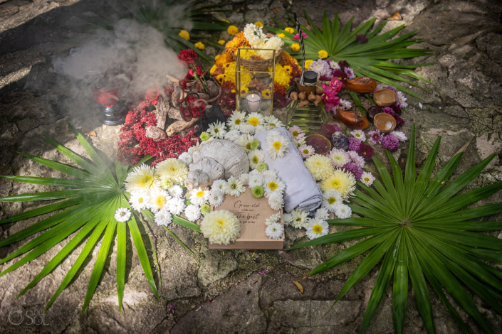 del sol photography ceremony altar Flowers and offerings prepared for a cenote vow renewal ceremony