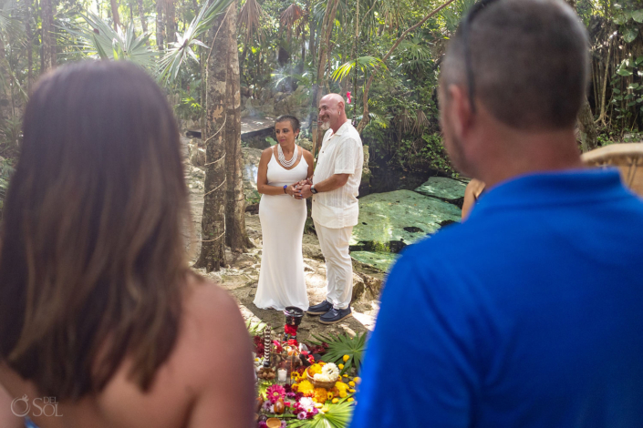 Family witnessing a cenote vow renewal ceremony in Riviera Maya