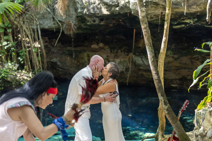 first kiss vows beside crystal clear cenote water