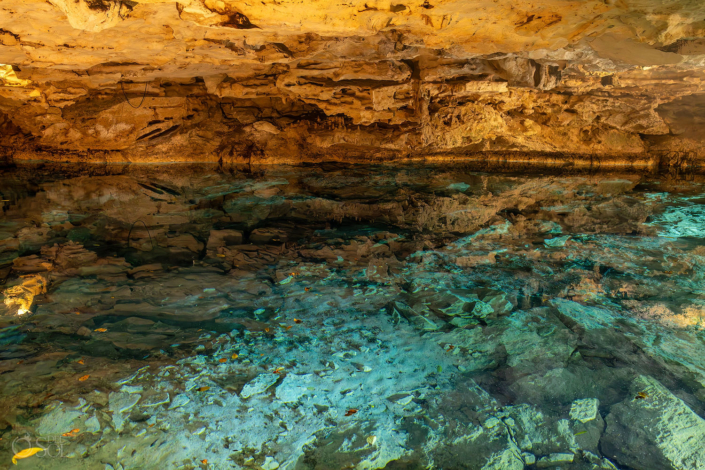 Crystal blue cave cenote illuminated by natural light in Riviera Maya