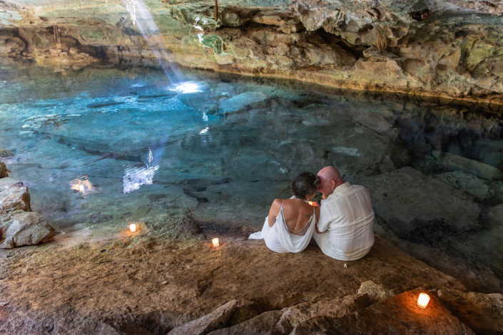 Cenote vow renewal ceremony in Mexico with cave reflections and crystal blue water