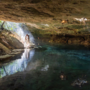 Epic-family-cenote-vow-renewal-ceremony-AT Copal smoke drifting through the jungle during a spiritual cenote vow renewal ceremony
