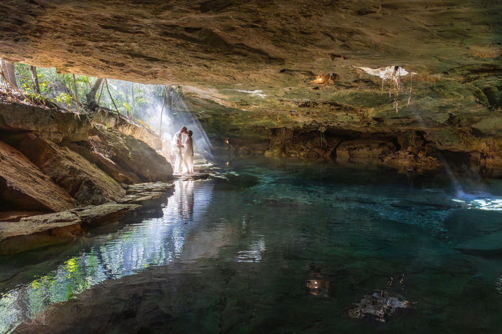 Copal smoke drifting through the jungle during a spiritual cenote vow renewal ceremony