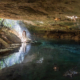 Copal smoke drifting through the jungle during a spiritual cenote vow renewal ceremony