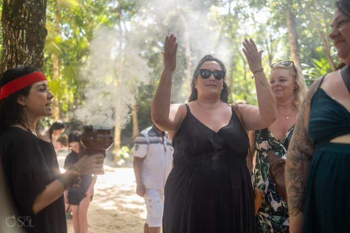 guests being blessed by copal smoke for a riviera maya cenote blessing ceremony