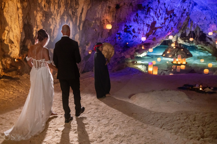 Cenote ceremony with turquoise water intimate wedding with floating candles