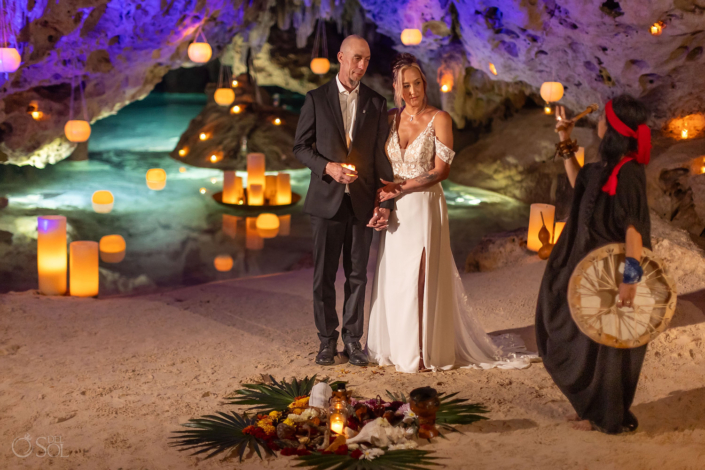 Ceremonial altar with candles copal, flowers, and sacred elements prepared for a cenote wedding ceremony