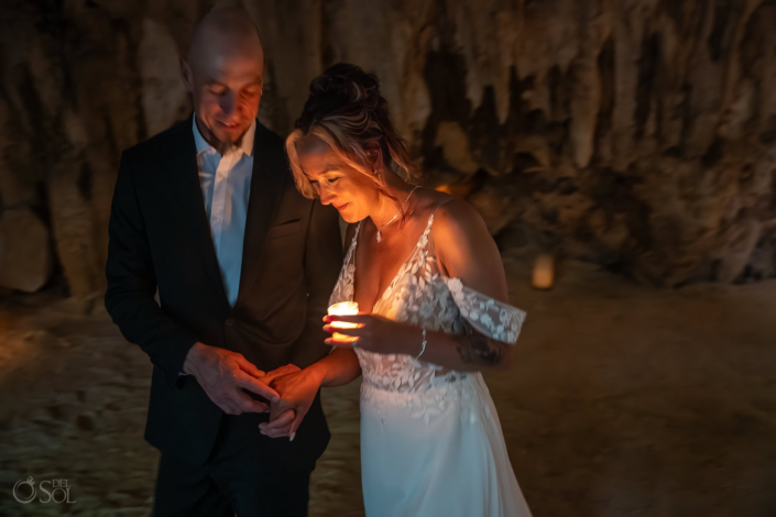 Bride holding a candle during the spiritual blessing ceremony.