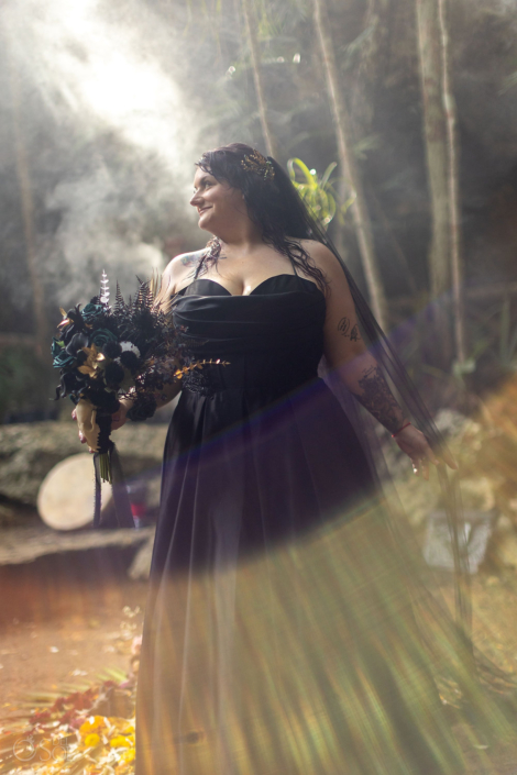 Jungle Wedding cenote Ceremony with bride wearing black wedding dress