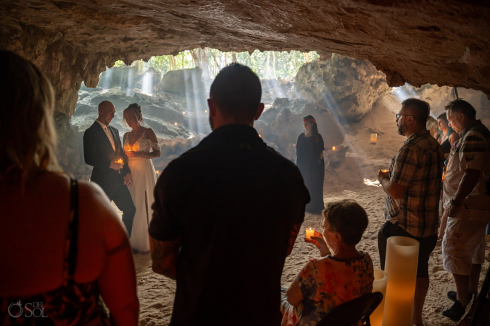 Cenote Wedding Ceremony Mexico spiritual blessing with guests and light beams
