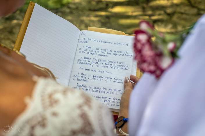 Couple exchanging handwritten vows during an intimate cenote wedding in Mexico