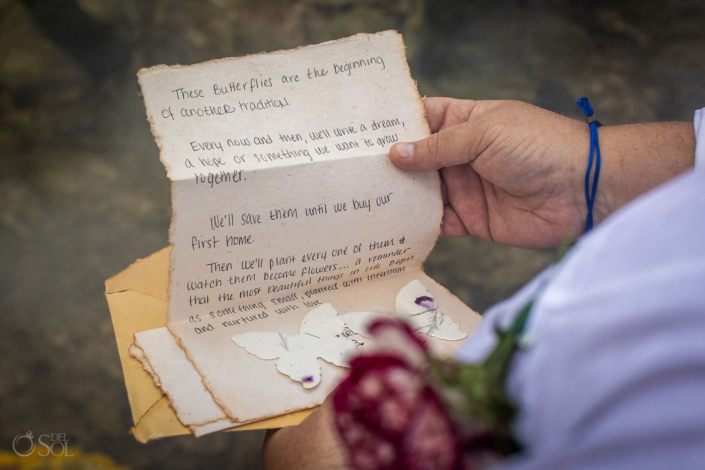 Couple exchanging handwritten promises during an intimate cenote wedding in Mexico