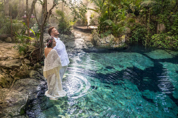 Cenote-Wedding-Experience-TB Couple stands in the water inside a private cenote wedding ceremony in the Riviera maya Mexican jungle