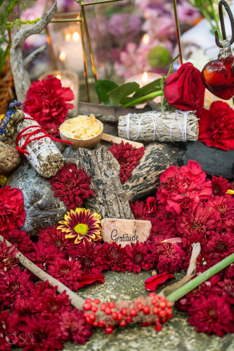 Gratitude - Spiritual wedding altar after an intimate cenote ceremony with flowers, seeds that represent 50 questions to ask before marriage